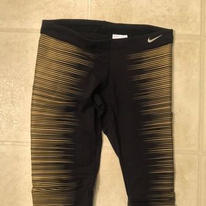 Nike dri-fit black + gold sparkle tights.